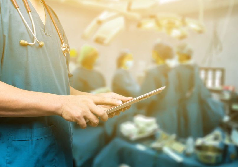 Male doctor,medical students or surgeon using digital tablet and laptop during the conference,Health Check with digital system support for patient,test results and patient registration,selective focus